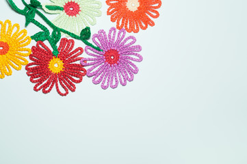 Handmade knitting wool flower isolated on white background