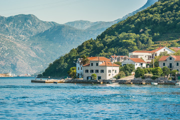 View on the coast from ferry transporting cars and people in Lepetane, Tivat, Montenegro.