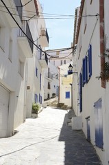White and blue alley in Cadaques, Spain
