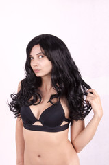 girl with long black hair in a black bra