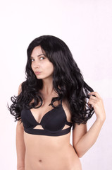 Fototapeta premium girl with long black hair in a black bra