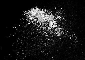 white powder explosion isolated on black background for graphic resources