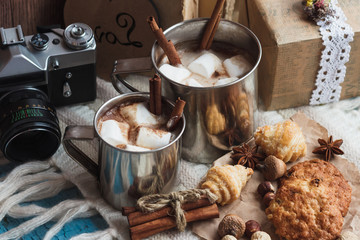 Metal mugs with cacao and marshmallow