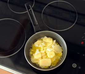 frying potatoes with onions for Spanish omelette