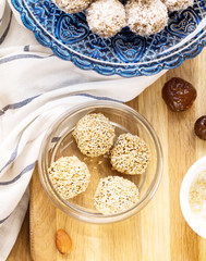 Candy with dates, dried apricots and nuts, vertical, selective focus, top view, ingredients