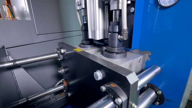 An operator uses a blow molding machine.     