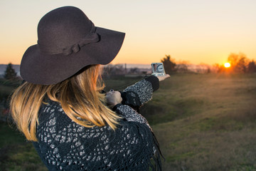 Girl with compass at sunset