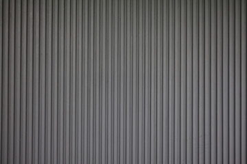 The background of wall is a straight pattern.