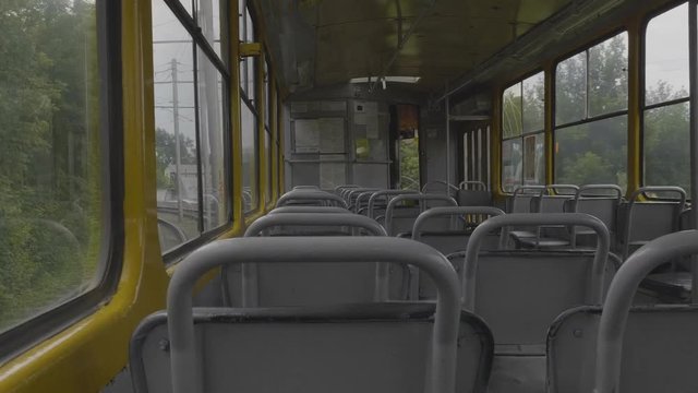 An empty tram rides around town, view from the cabin.