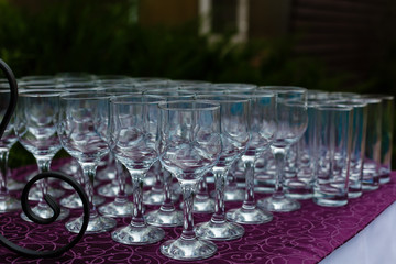 Beautiful champagne glasses defocused on buffet table in restaurant and blurred background