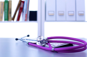 medical stethoscope with a computer on the desk