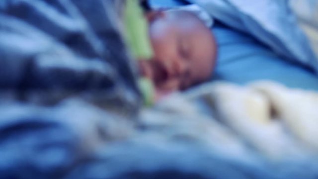 baby sleeping through the night in the crib