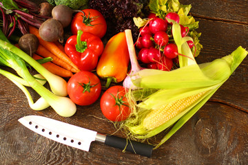 salad from fresh vegetables in a plate on a table, selective focus