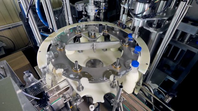 Fast moving line of a milk bottling workshop.  