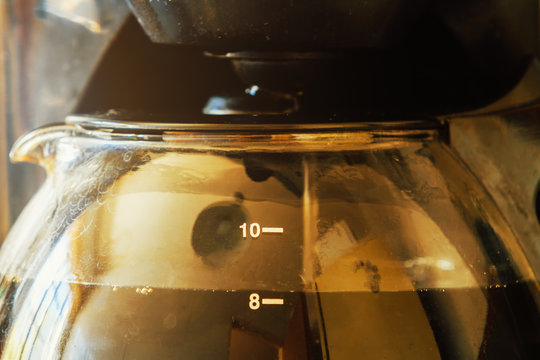 Close-up Of Electric Glass Coffee Pot With Measurer