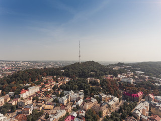 Main square in Lvov, aerial view of city center summer time, old town from above, tv tower, green field