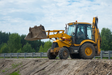The work of a bulldozer for road construction