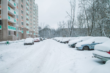 Cars are under the snow on Moscow city parking, Russia