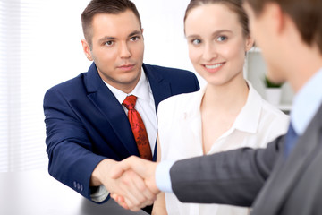 Two business man shaking hands to each other finishing up the meeting