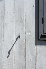 Composition in gray with old window and stopper
