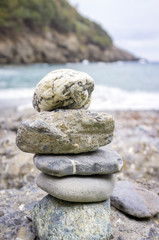 Fototapeta na wymiar Pile stones on a beach. Color image