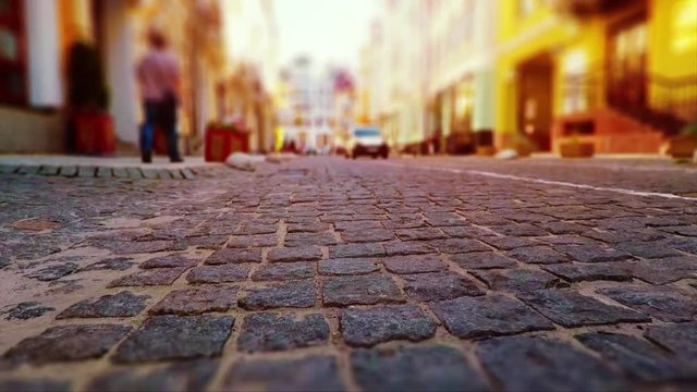 Low angle walking by the Old Town street