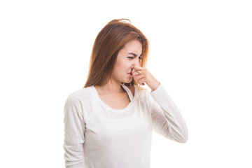 Fototapeta premium Young Asian woman holding her nose because of a bad smell.