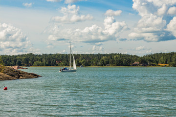 Naantali, Finland coast of the Baltic Sea with yacht. From Muumin World park.