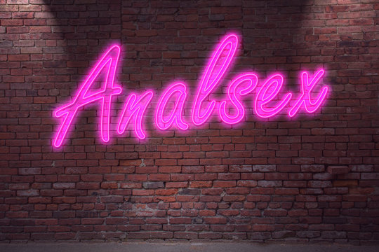 Leuchtreklame Analsex an Ziegelsteinmauer