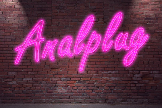 Leuchtreklame Analplug an Ziegelsteinmauer