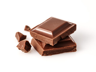 Macro photo  of Chocolate bar. Broken pieces over white background.