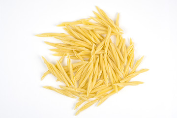 Dry pasta on white background, trofie.