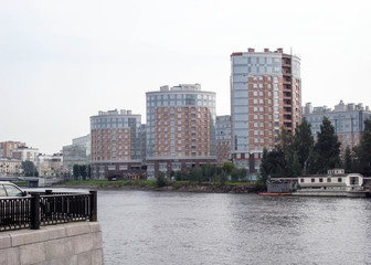 Fototapeta na wymiar New style of housing construction. Housing near the water