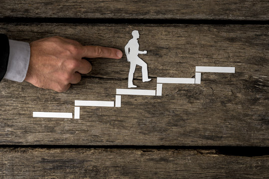 Businessman climbing the corporate ladder