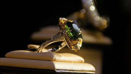 Jewelry with emeralds and diamond. Gemstones. Gold ring with emerald
