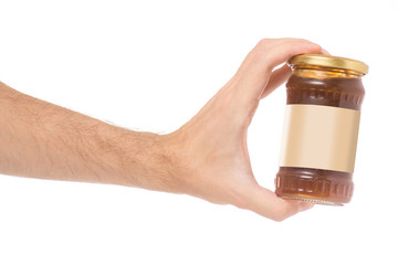 Male hand jar jam apricot on white background isolation © Kabardins photo