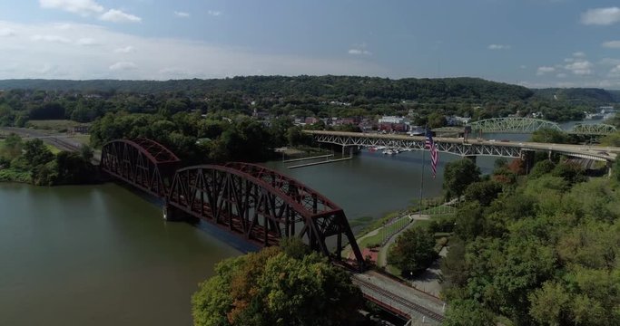 A high angle forward aerial view of a small Western Pennsylvania town on the Ohio River.  	