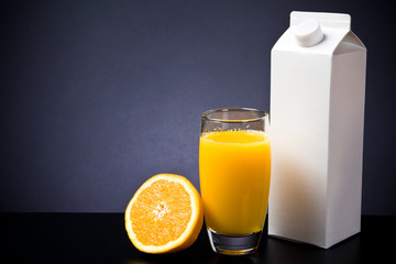 Glass And Carton Of Orange Juice