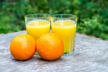Fresh orange juice with oranges fruit outdoors
