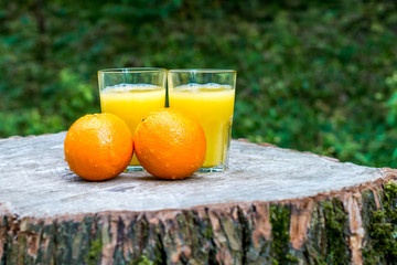 Fresh orange juice with oranges fruit outdoors