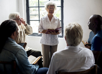 Group of christianity people reading bible together