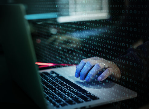 Hacker working on computer