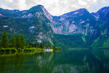 Fototapeta na wymiar Popular beautiful village in Austria ,Hallstatt in the green summer scenery and crystal clear water 