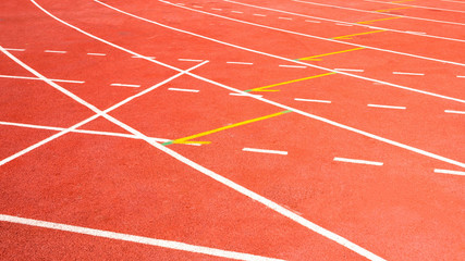Fototapeta premium red running track on athletic stadium