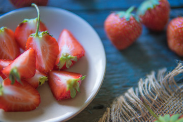 Strawberry on a wooden board in rustic style