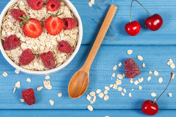 Oatmeal and oat flakes with fruits, healthy lifestyle and nutrition concept