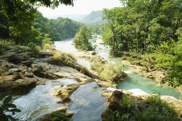 View of valley from waterfall to river on the cliffs in tropical lake at sunny summer day