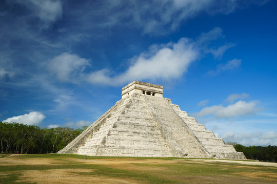 Maya pyramid temple of Kukulkan in Mexico. Ancient symbol of architecture at summer cloudy day
