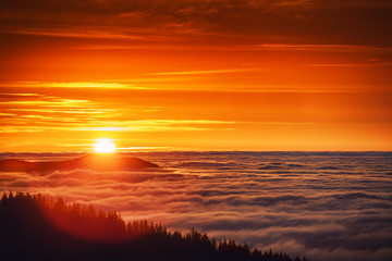 Fototapeta na wymiar Aerial view of Sunrise over mountain and fog