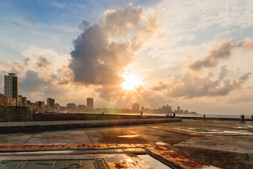 Obraz premium Famous embankment promenade Malecon at sunset after storm. Havana, Cuba.